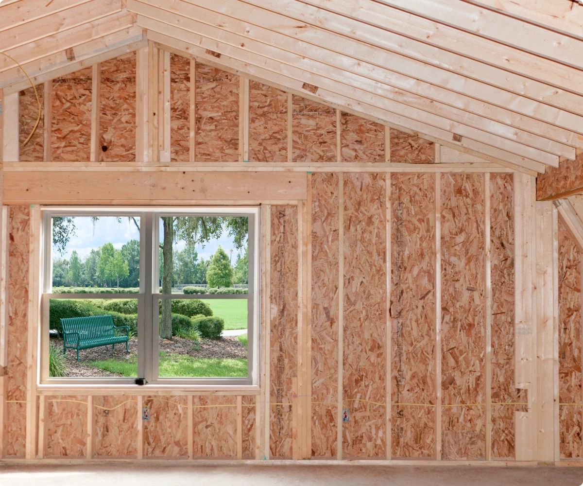 Exposed two by four framing in new room addition.