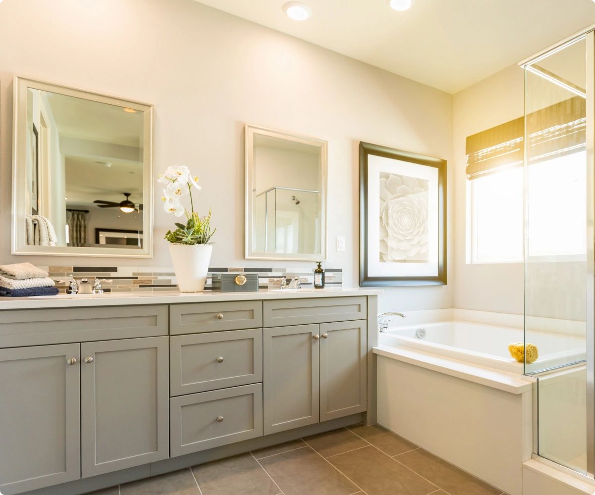 Bright, warm batghroom setting with sunlight coming through window.