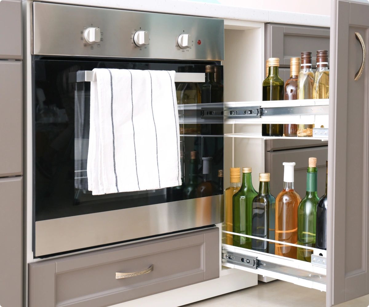Kitchen oven and slide-out cabinet
